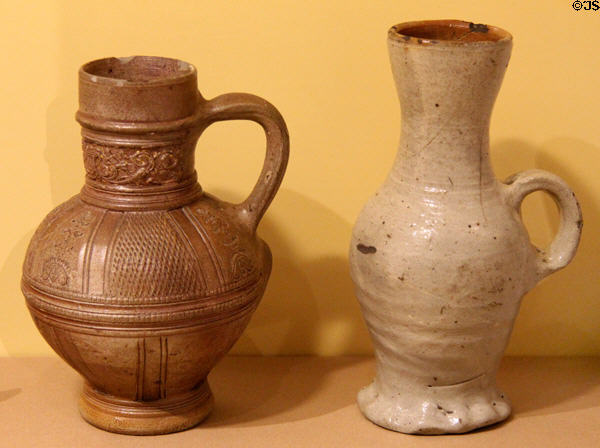 German salt-glazed stoneware tankards of brown clay (1594-1600) by Jan Alers of Raeren & in Siegburg-type (early 1500s) at Royal Ontario Museum. Toronto, ON.