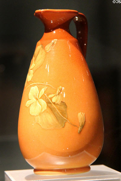 Earthenware pitcher with yellow flower (1894) by Amelia Browne Sprague of Rookwood Pottery Co. of Cincinnati at Royal Ontario Museum. Toronto, ON.