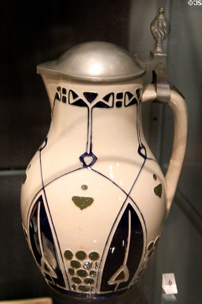 Salt-glazed stoneware & pewter pitcher (1905-10) by Josephy Hahn made by Reinhold Merkelbach of Grenzhausen, Germany at Royal Ontario Museum. Toronto, ON.
