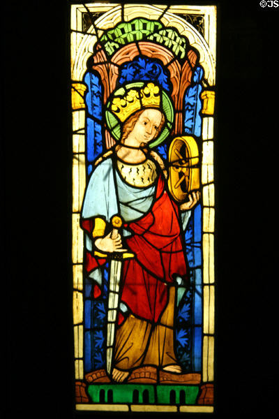 Stained glass window with St Catherine of Alexandria with symbols of wheel & sword at Royal Ontario Museum. Toronto, ON.