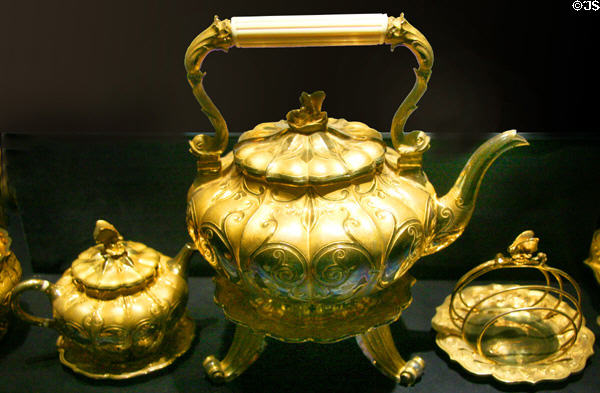 Silver-gilt travelling set (1821-6) by Philip Rundell of London including tea pot & toast rack with butterfly handles used by mistress of George IV at Royal Ontario Museum. Toronto, ON.