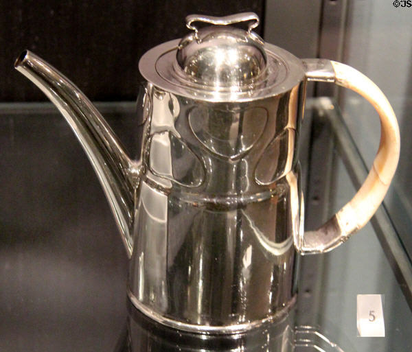 Cymric teapot in silver with ivory (c1900) by Archibald Knox & made for Liberty & Co by W.H. Haseler at Royal Ontario Museum. Toronto, ON.