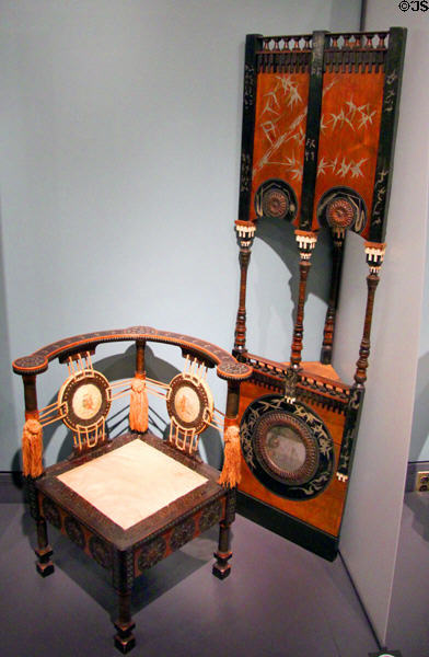 Corner chair & hanging corner cabinet atop base (c1895-1904) by Carlo Bugatti an Italian working in Paris at Royal Ontario Museum. Toronto, ON.