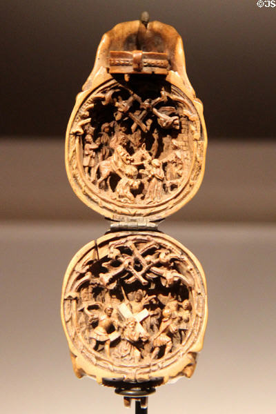 Carved boxwood prayer bead with entry of Jerusalem above & Christ carrying Cross below at Art Gallery of Ontario. Toronto, ON.