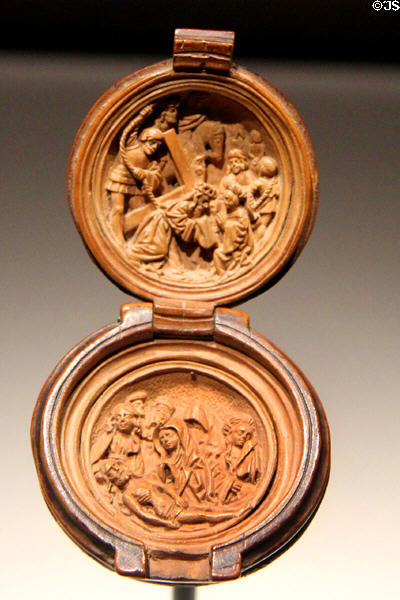 Carved boxwood prayer bead with Christ carrying Cross above & the Lamentation below at Art Gallery of Ontario. Toronto, ON.