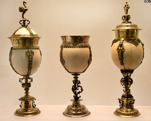 Ostrich egg cups in gilded silver mounts (c1600) with flanking covered cups from Nuremberg, Germany & middle cup from England at Art Gallery of Ontario. Toronto, ON.