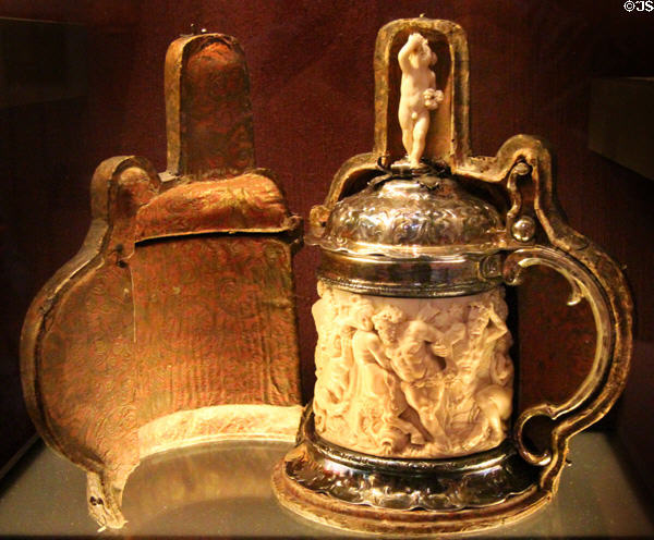 Sculpted ivory tankard with silver mounts in leather case (mid 17thC) by David Schwestermüller I from Augsburg, Germany at Art Gallery of Ontario. Toronto, ON.