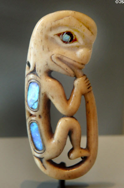 Small Northwest Coast Native amulet carving with shell inserts at Art Gallery of Ontario. Toronto, ON.