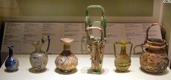 Array of blown glass vessels with thread decoration (1st-5th C CE) from Roman Empire at Montreal Museum of Fine Arts. Montreal, QC.