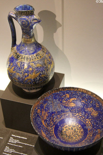 Persian blue-glazed fritware ewer & bowl (late 13th- early 14th C) prob. from Kashan, Iran at Montreal Museum of Fine Arts. Montreal, QC.