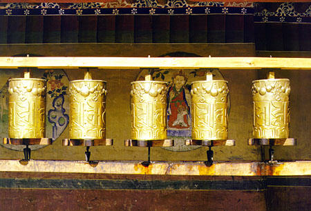 Golden prayer wheels in Drepung Monastery, Tibet. China.