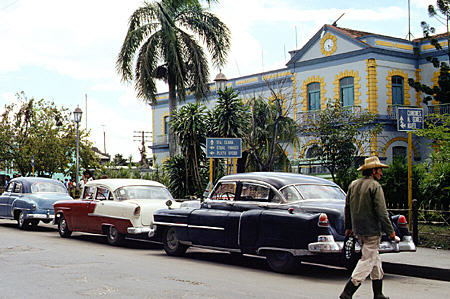Old cars in front of Sagua la Grande rail station. Cuba.