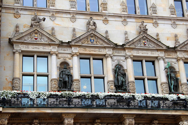 Statues representing early rulers & guild members surrounding windows at Hamburg City Hall. Hamburg, Germany.