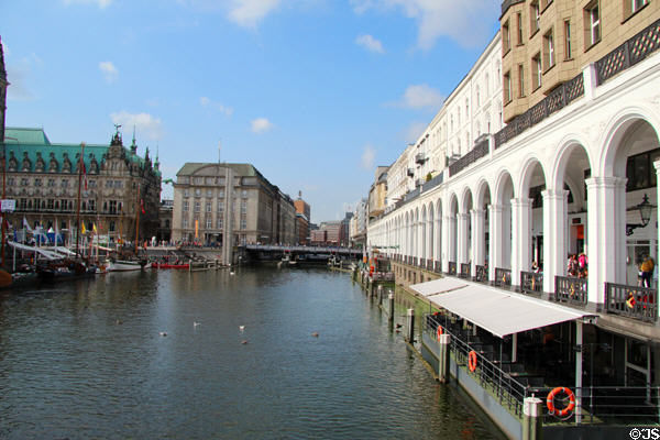 Historic Venetian-style arcade along Kleiner Alster canal with Bucerius Kunst Forum on opposite bank. Hamburg, Germany.