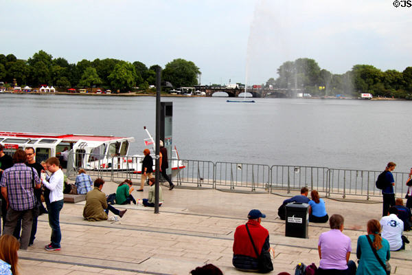 Tourists enjoy Lake Alster view. Hamburg, Germany.