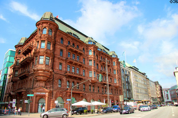 Victorian-Romanesque red stone building housing Hamburger Hof shopping center on Jungfernstieg. Hamburg, Germany.