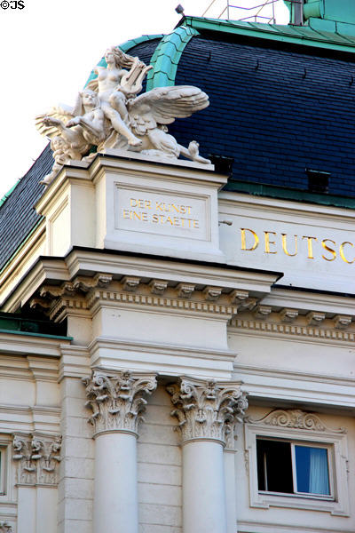 Roof top statue inscribed "A Place for Art" at German Theater. Hamburg, Germany.