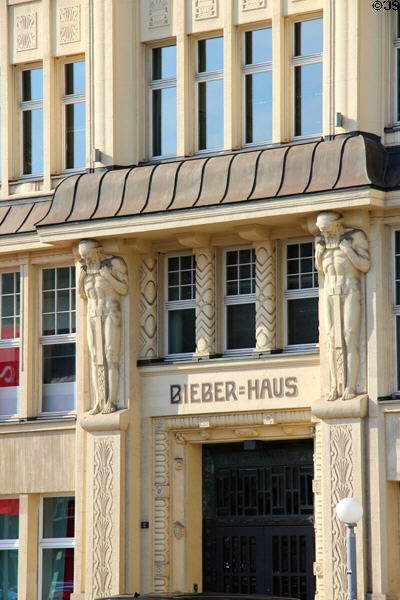 Atlas figures supporting overhang at Bieberhaus entrance. Hamburg, Germany.