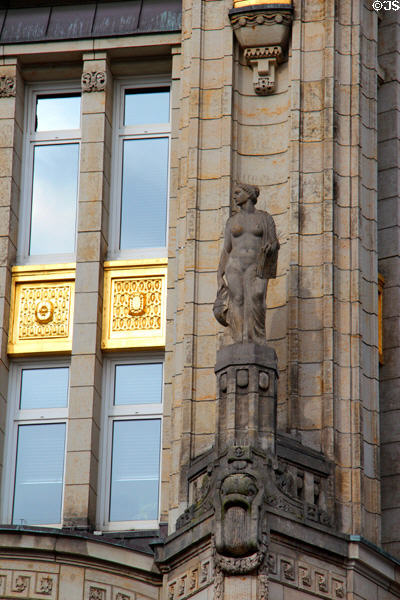 Statue & gold panels on Deutsche Bank building at Mönckebergstraße U-Bahn station. Hamburg, Germany.