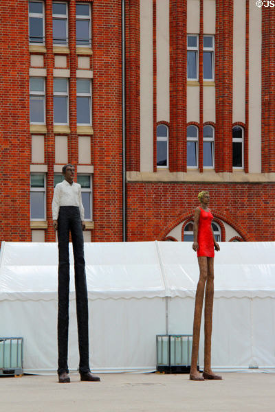 Sculpted ultra-tall figures in front of Hamburg Central Library. Hamburg, Germany.