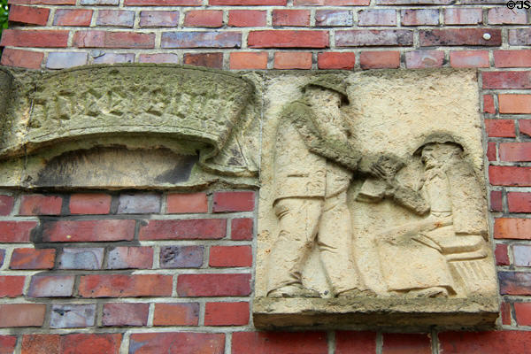 Carving of newspaper seller on "Die Zeit" building. Hamburg, Germany.
