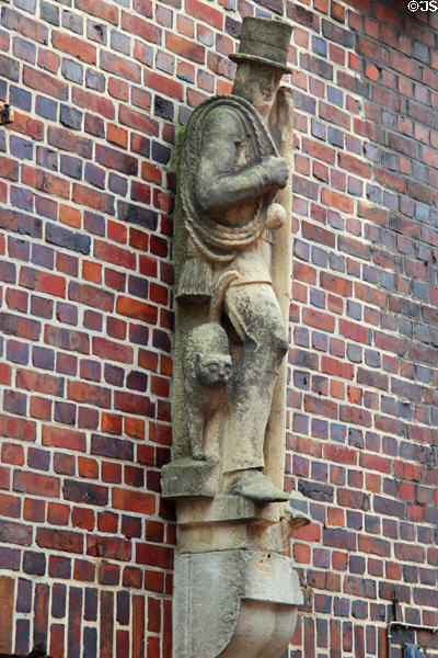 Sculpture of chimney sweep on brick building at Steinstraße & Mohlenhofstraße. Hamburg, Germany.