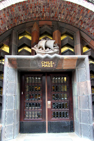 Entrance to Chilehaus capped by sculpture of sailing ship. Hamburg, Germany.