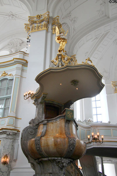 Marble baroque pulpit crowned by Angel of Annunciation (1910) sculpted by Otto Lessing at St Michael's Church. Hamburg, Germany.