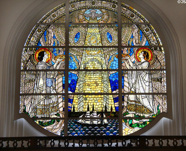 Stained glass window (20thC) with the light of Holy Spirit shining on Hamburg between two angels. Hamburg, Germany.
