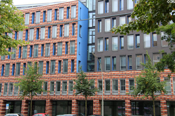 Red. white & gray brick commercial building on Ludwig-Erhard-Straße B4. Hamburg, Germany.
