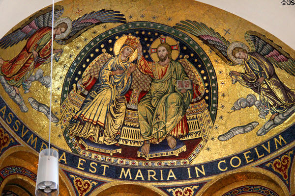 Mosaic with inscription reading "Mary is taken up into Heaven" (post WWII) in apse of Domkirche St Marien. Hamburg, Germany.