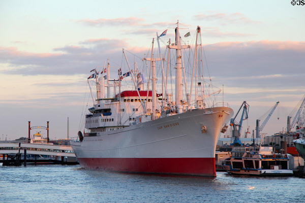 Profile of Museum Ship Cap San Diego, a German built cargo ship (1961) on Elbe River at dusk. Hamburg, Germany.