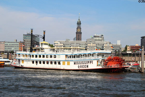 Mississippi Queen paddle wheel tour boat on Elbe River with St Michael's Church in background. Hamburg, Germany.