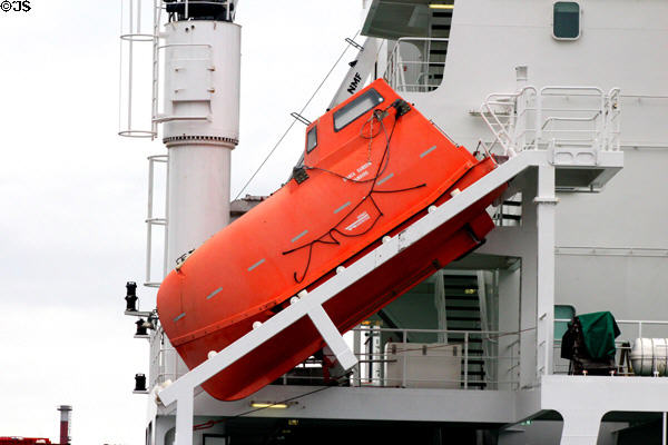 Sealed, waterproof life boat on slide for fast evacuation on container ship. Hamburg, Germany.