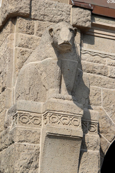 Detail of carved polar bear on stone clock tower at St Pauli Pier. Hamburg, Germany.