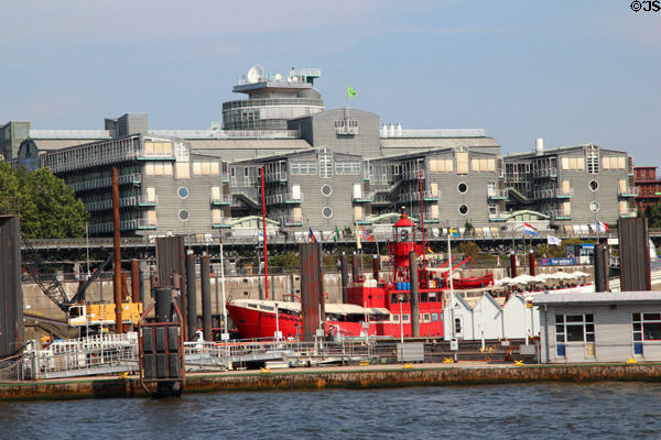 Gray Hamburg New City with round windows over docked red light ship. Hamburg, Germany.