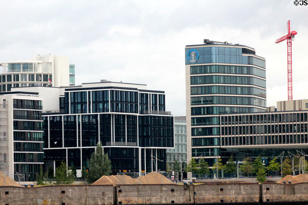 Three level black glass building (Am Kaiserkai 1 & Grosser Grasbrook 12) in HafenCity. Hamburg, Germany. Architect: nps tchoban voss.