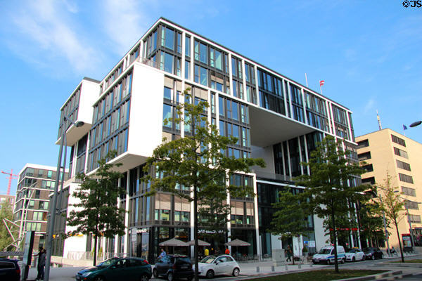 Three level black glass building (Am Kaiserkai 1 & Grosser Grasbrook 12) from corner perspective in HafenCity. Hamburg, Germany.