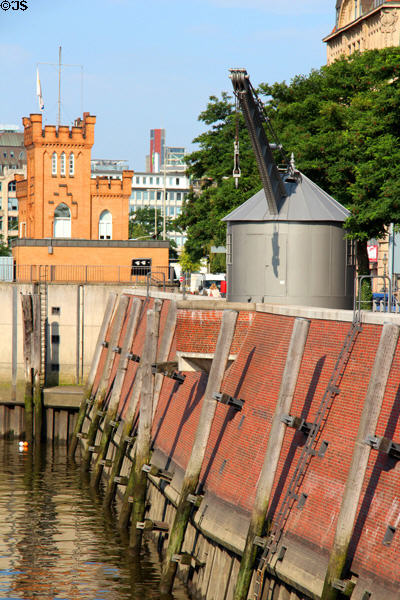 Antique crane (Neuer Kran) & Hamburger Elbinsel Tower beside Zoll canal. Hamburg, Germany.