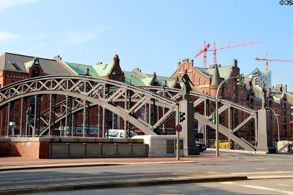 Brooksbrücke cast iron bridge (1887) with sculptures on corner pillars. Hamburg, Germany.