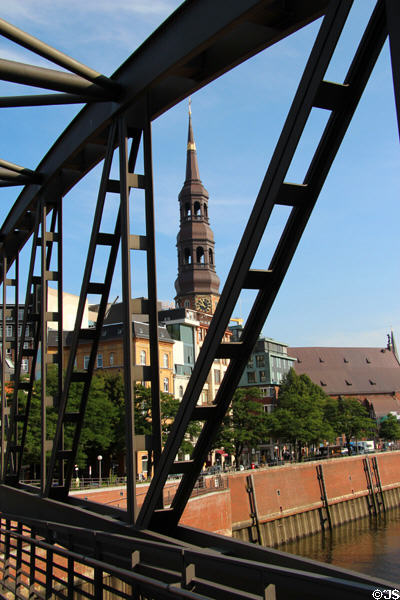 St Catherine's Church tower seen through girders of Kibbelsteg brücke. Hamburg, Germany.