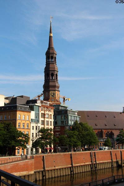 St Catherine's Church tower over residential buildings beside Zollkanal. Hamburg, Germany.