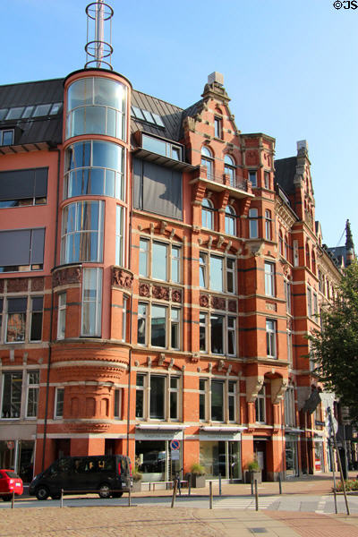 Heritage building with modern corner tower (Zippelhaus 2) beside St Catherine's Church. Hamburg, Germany.