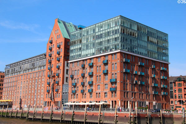 Modern building with Hanseatic brick style elements on shoreline of Elbe River in Altona borough. Hamburg, Germany.