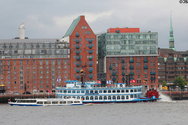 Tourist boats sailing along Elbe River in front of Altona, western borough of Hamburg. Hamburg, Germany.