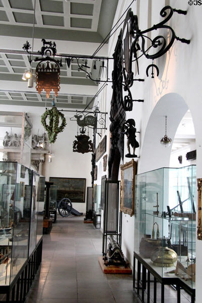 Gallery with historic wrought iron signs & other items at Hamburg History Museum. Hamburg, Germany.