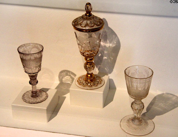 Goblets (18thC) for display incised with coats-of-arms, town scenes or monuments at Hamburg History Museum. Hamburg, Germany.