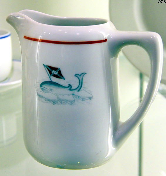 Porcelain milk pitcher (1936) with image of whale & flag from whaling shipping company at International Maritime Museum. Hamburg, Germany.