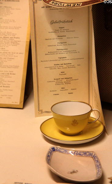 Menu, tea cup & plate from passenger ship at Emigration Museum BallinStadt. Hamburg, Germany.