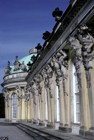 Sanssouci Palace facade with carved figures holding up roof. Potsdam, Germany. Style: Roccoco. Architect: Georg Wenzelaus von Knobelsdorff.